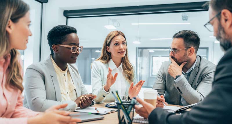 employees discussing work in the office