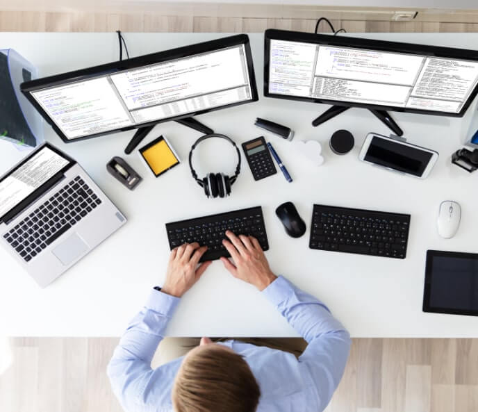 An employee working on laptops