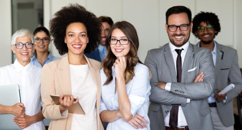 group of business people smiling and cheering