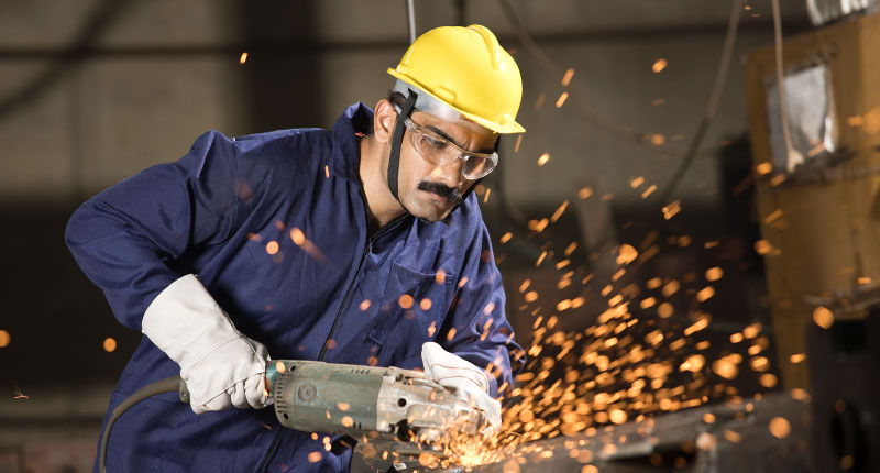 Mechanic using circular saw grinder tool